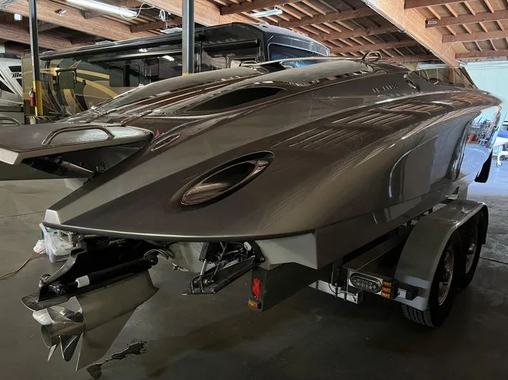 Unique Yacht Photos Pics 2008 Porsche Donzi boat in a garage, sleek design on a trailer.