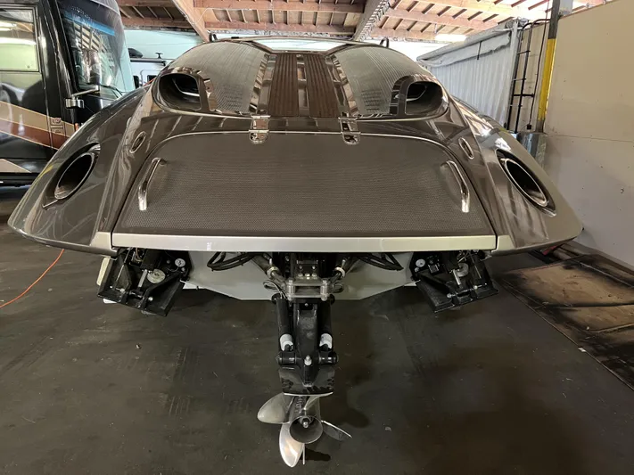 Unique Yacht Photos Pics 2008 Porsche Donzi boat with sleek design and dual propellers in a garage setting.