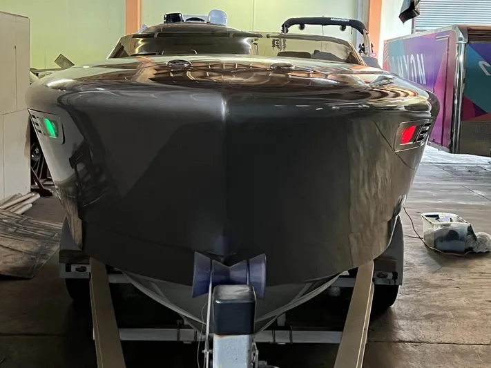 Unique Yacht Photos Pics 2008 Porsche Donzi boat in a garage, front view with navigation lights.