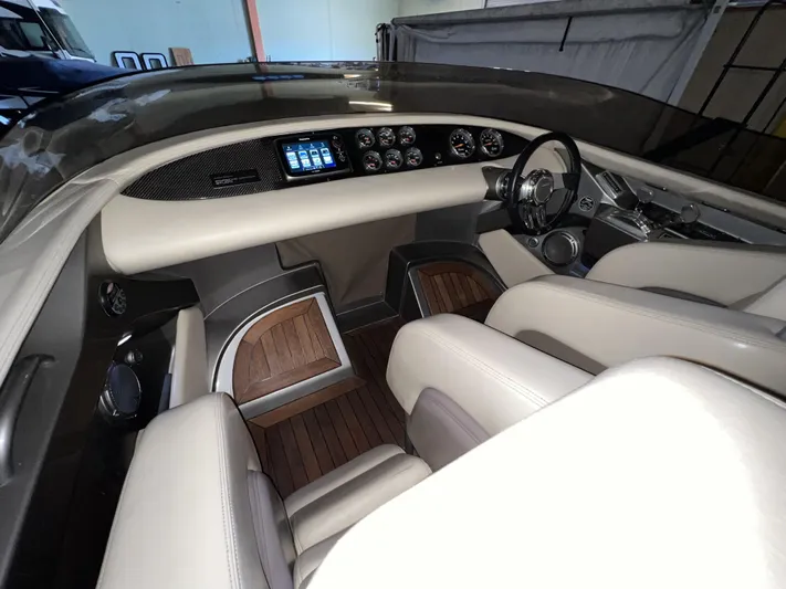 Unique Yacht Photos Pics Interior of a 2008 Porsche/Donzi boat with sleek dashboard and leather seating.