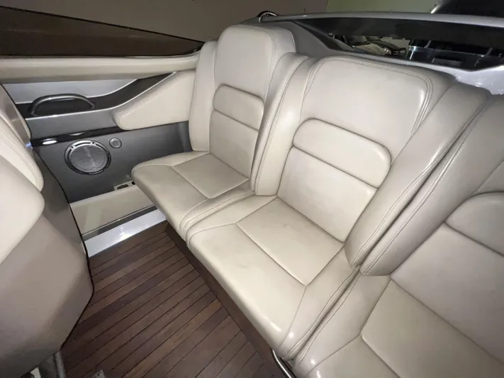 Unique Yacht Photos Pics 2008 Porsche Donzi interior with beige leather seats and wooden flooring.