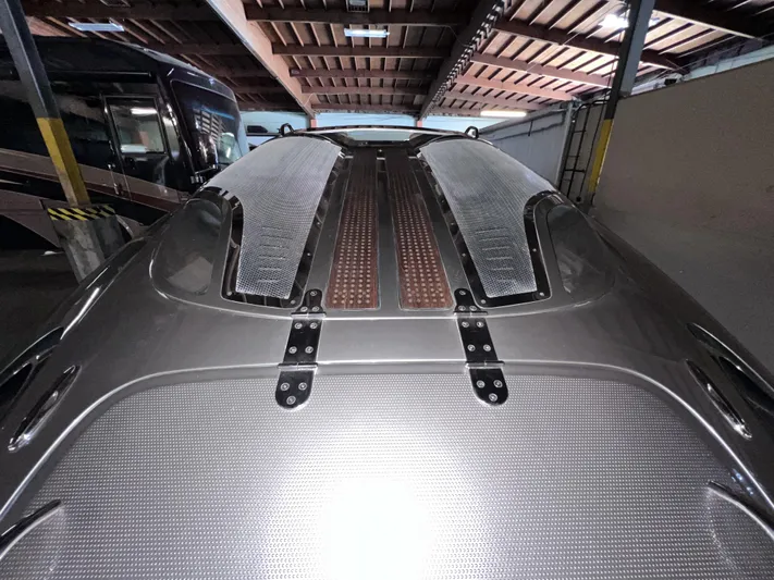 Unique Yacht Photos Pics 2008 Porsche Donzi boat in storage, showcasing sleek design and metallic finish.