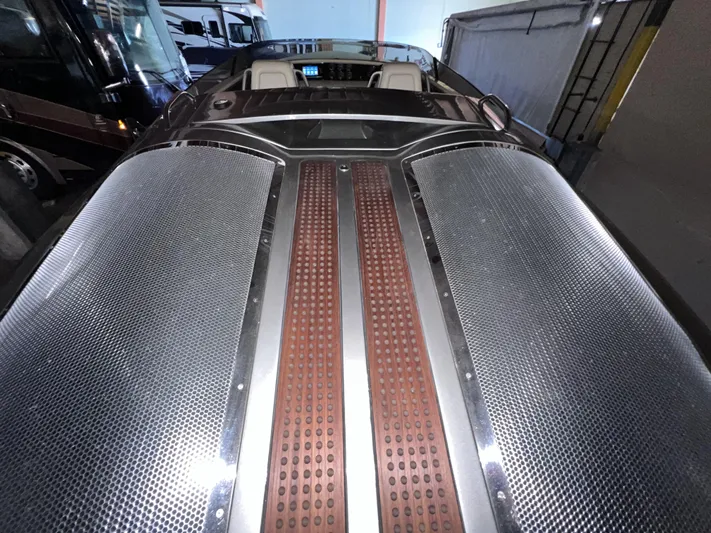 Unique Yacht Photos Pics 2008 Porsche Donzi boat with sleek metallic and wood accents in a garage setting.