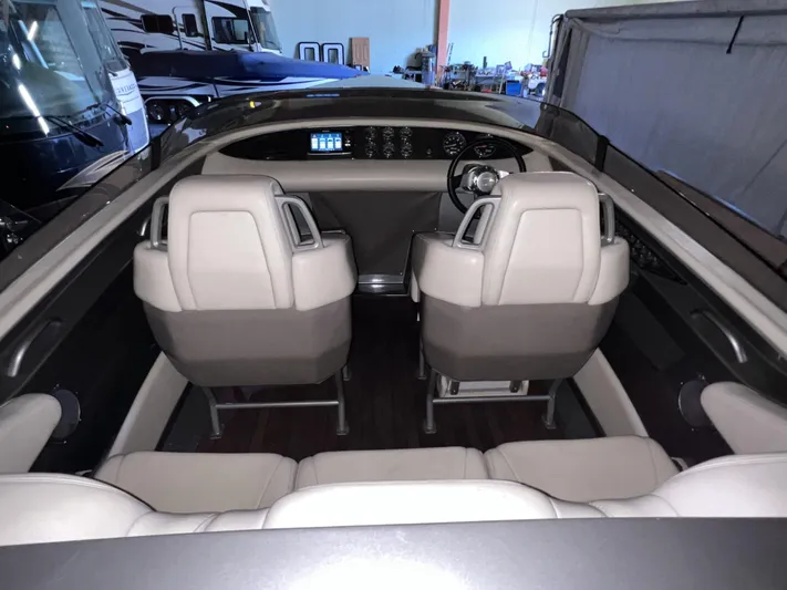 Unique Yacht Photos Pics Interior of a 2008 Porsche/Donzi boat with beige leather seats and modern dashboard.