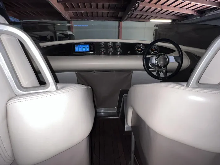 Unique Yacht Photos Pics Interior view of a 2008 Porsche/Donzi boat cockpit with modern controls and steering wheel.