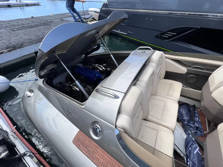 Unique Yacht Photos Pics 2008 Porsche Donzi boat with open engine compartment, docked by the water.