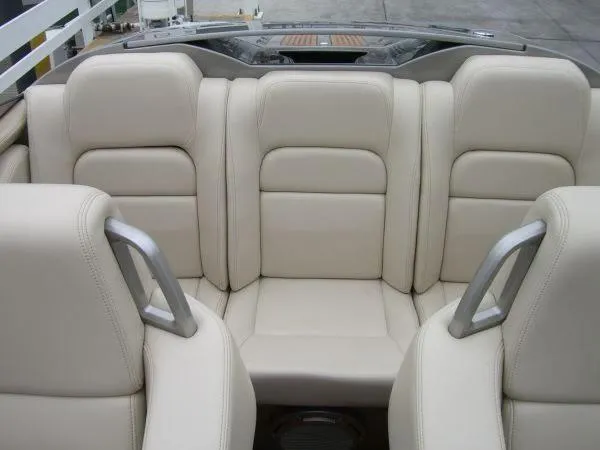 Unique Yacht Photos Pics 2008 Porsche Donzi interior with beige leather seats and metal accents.