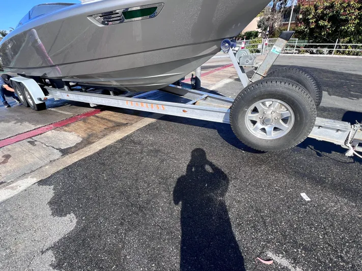 Unique Yacht Photos Pics Trailer carrying a 2008 Porsche Donzi boat on a sunny day.