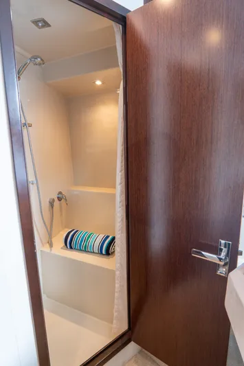 Epic Yacht Photos Pics Shower area in 2013 Cruisers Yachts 48 Cantius, featuring sleek design and modern fixtures.