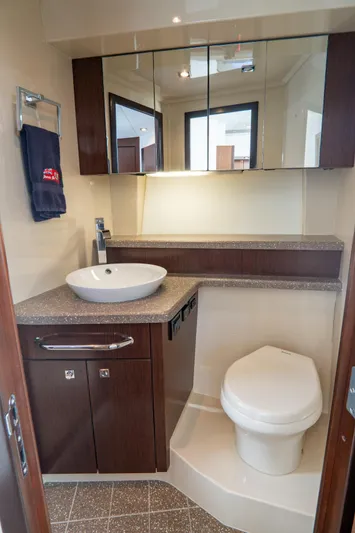 Epic Yacht Photos Pics Luxurious bathroom in 2013 Cruisers Yachts 48 Cantius with modern fixtures and elegant design.