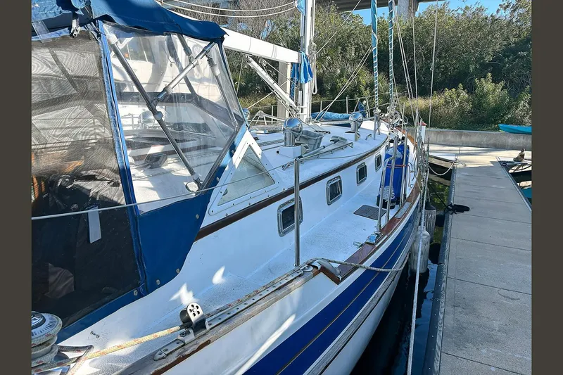 Makani Yacht Photos Pics Sailboat Gozzard 44 MK1 AC, 1993 model, docked at marina with blue accents.