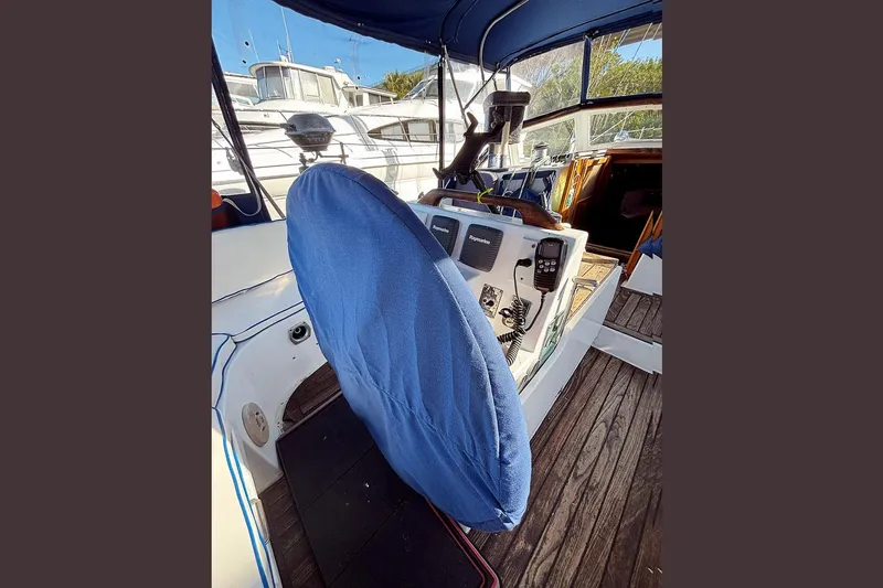 Makani Yacht Photos Pics Cockpit of 1993 Gozzard 44 MK1 AC sailboat with covered steering wheel.