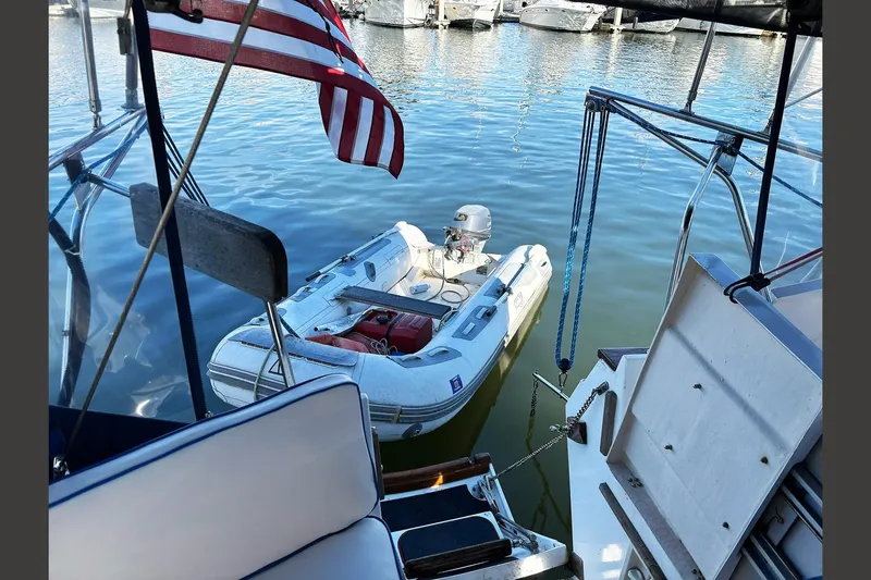 Makani Yacht Photos Pics Sailboat view with dinghy and American flag, Gozzard 44 MK1 AC, 1993 model.