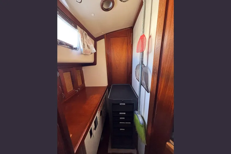 Makani Yacht Photos Pics Interior of 1993 Gozzard 44 MK1 AC sailboat with wooden cabinetry and storage.