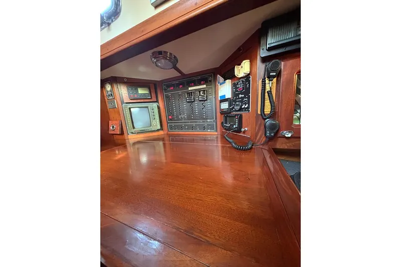 Makani Yacht Photos Pics Navigation station of 1993 Gozzard 44 MK1 AC yacht with control panels and communication equipment.