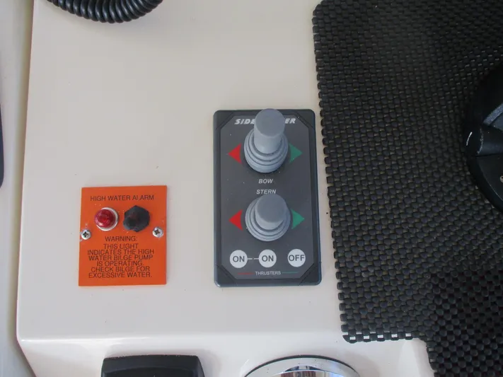  Yacht Photos Pics Control panel of a 2007 Mainship Pilot 34 Sedan with thruster and water alarm indicators.