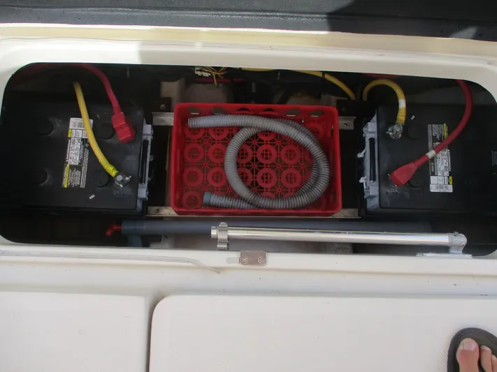  Yacht Photos Pics Battery compartment of a 2007 Mainship Pilot 34 Sedan with wiring and ventilation hose.