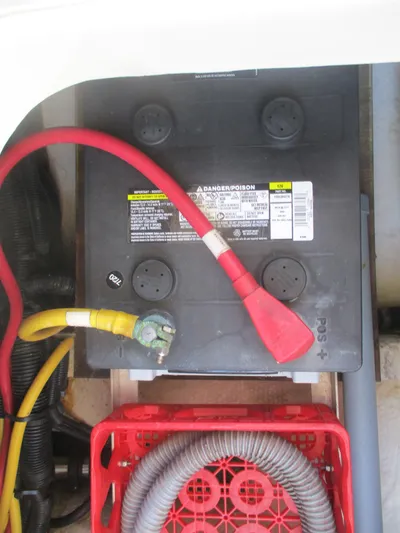  Yacht Photos Pics Battery compartment of 2007 Mainship Pilot 34 Sedan with cables and storage crate.