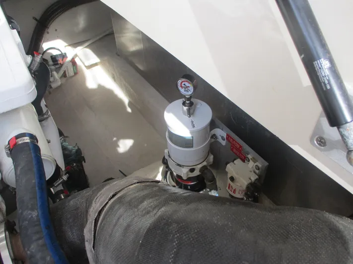  Yacht Photos Pics Engine compartment of 2007 Mainship Pilot 34 Sedan with visible components and hoses.