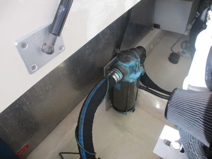  Yacht Photos Pics Engine compartment of 2007 Mainship Pilot 34 Sedan, showing hoses and mechanical components.