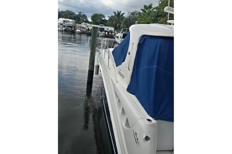  Yacht Photos Pics 2008 Sea Ray 40 Sundancer yacht docked, featuring blue covers and sleek design.