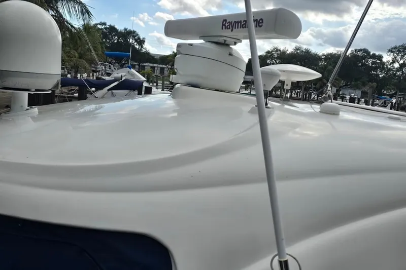  Yacht Photos Pics 2008 Sea Ray 40 Sundancer yacht with Raymarine radar, docked under cloudy sky.