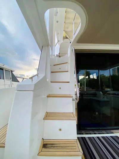Ivy Therapy Yacht Photos Pics Staircase on 2015 Azimut 50 yacht with wooden steps and sleek design.