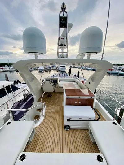 Ivy Therapy Yacht Photos Pics 2015 Azimut 50 yacht with spacious deck, docked at marina.