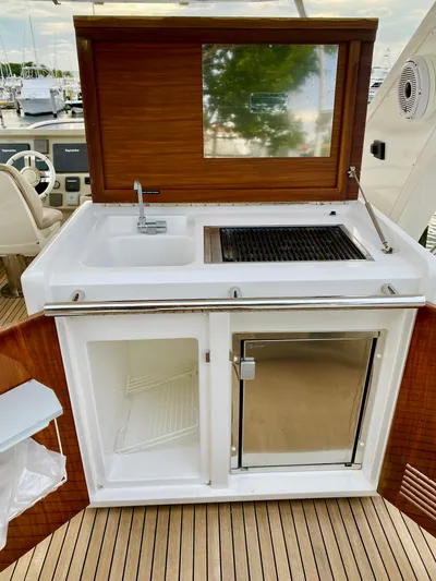 Ivy Therapy Yacht Photos Pics Outdoor kitchen on 2015 Azimut 50 yacht with sink, grill, and fridge.