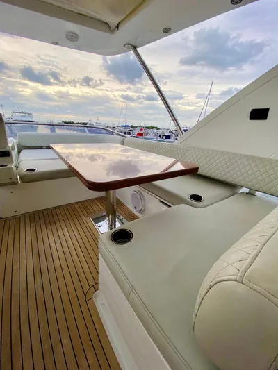 Ivy Therapy Yacht Photos Pics Luxurious 2015 Azimut 50 yacht interior with elegant seating and wooden deck.