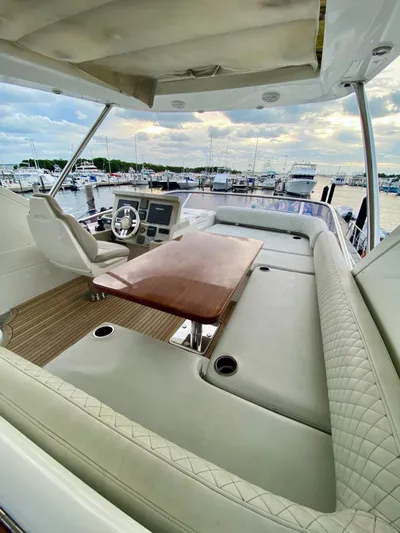 Ivy Therapy Yacht Photos Pics Luxurious 2015 Azimut 50 yacht interior with elegant seating and helm, docked at marina.