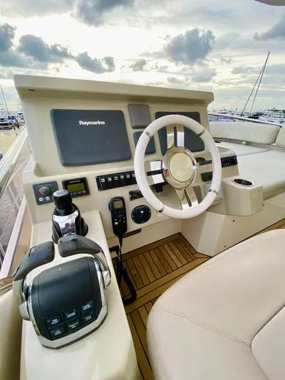 Ivy Therapy Yacht Photos Pics Azimut 50 yacht helm, 2015 model, featuring modern navigation controls and luxurious seating.