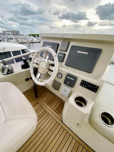 Ivy Therapy Yacht Photos Pics Helm of 2015 Azimut 50 yacht with Raymarine navigation system.