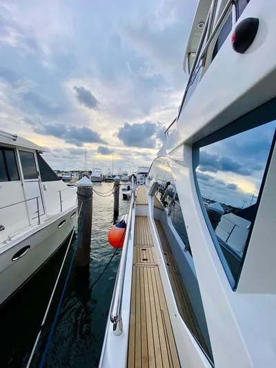 Ivy Therapy Yacht Photos Pics 2015 Azimut 50 yacht docked at marina under cloudy sky.