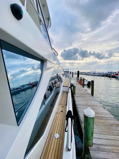 Ivy Therapy Yacht Photos Pics Azimut 50 yacht docked at marina, 2015 model, with scenic waterfront view.