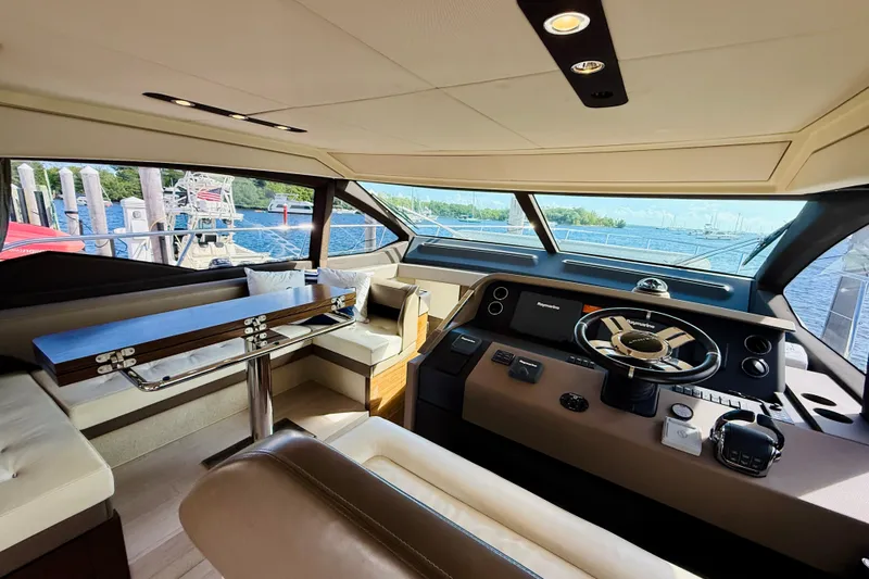 Ivy Therapy Yacht Photos Pics Luxurious interior of a 2015 Azimut 50 yacht with helm and seating area.