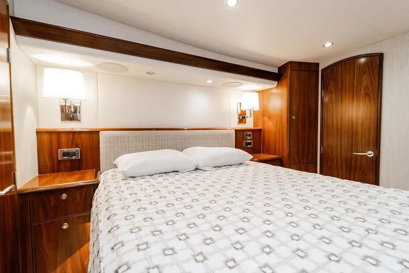 Trailer Trash Yacht Photos Pics Luxurious cabin interior of 2021 Viking 58 Convertible yacht with elegant wood finish.