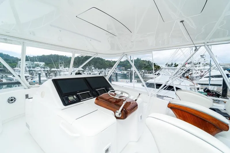 Trailer Trash Yacht Photos Pics Interior view of 2021 Viking 58 Convertible yacht helm station at marina.