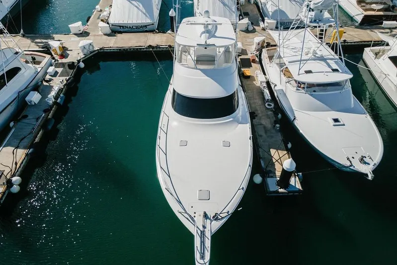 Trailer Trash Yacht Photos Pics Aerial view of a 2021 Viking 58 Convertible yacht docked at a marina.