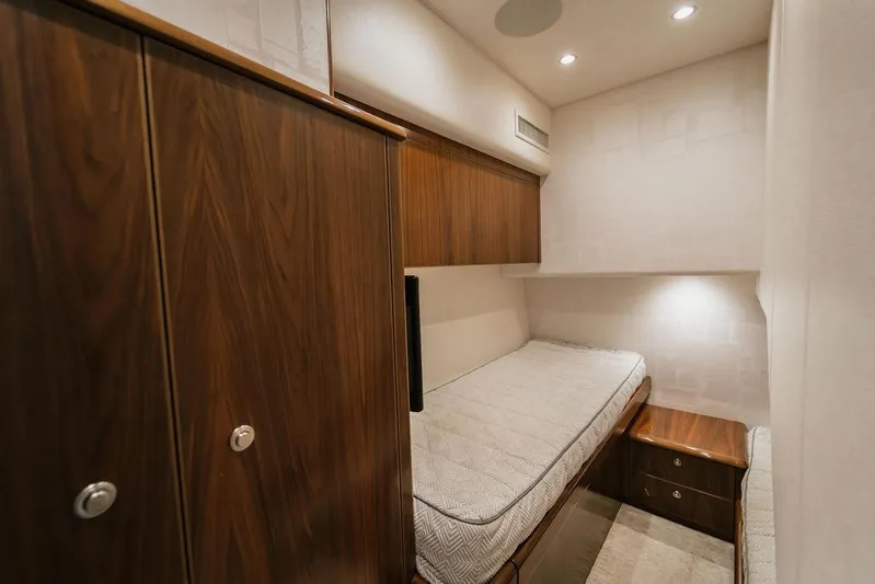 Trailer Trash Yacht Photos Pics Luxurious cabin interior of 2021 Viking 58 Convertible yacht with wood finishes.