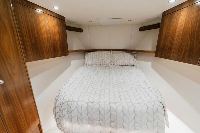 Trailer Trash Yacht Photos Pics Luxurious cabin interior of 2021 Viking 58 Convertible yacht with elegant wood finishes.