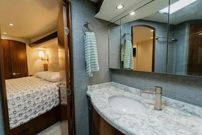 Trailer Trash Yacht Photos Pics Luxurious bathroom and bedroom interior of 2021 Viking 58 Convertible yacht.