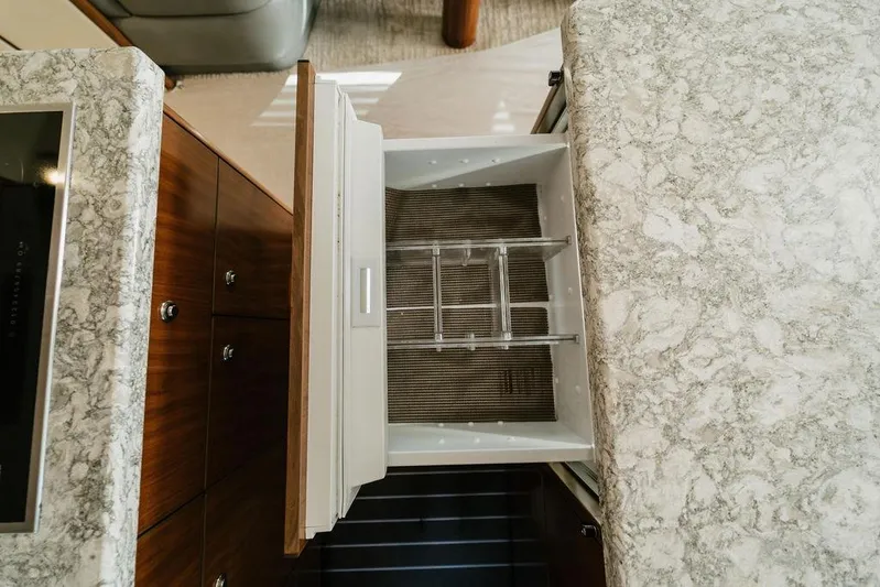 Trailer Trash Yacht Photos Pics Open drawer in 2021 Viking 58 Convertible yacht kitchen with marble countertop.