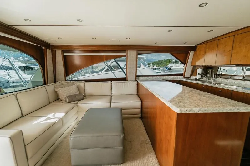 Trailer Trash Yacht Photos Pics Luxurious interior of 2021 Viking 58 Convertible yacht with elegant seating and kitchen area.