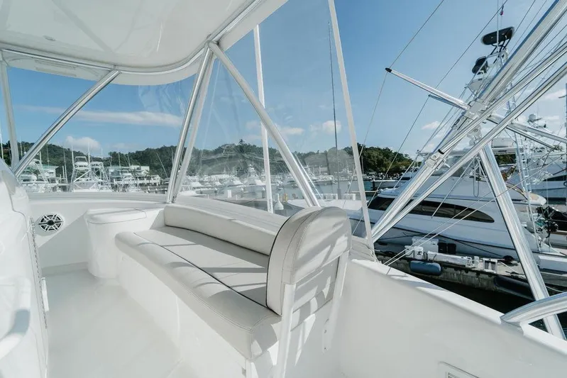 Trailer Trash Yacht Photos Pics Luxurious interior of 2021 Viking 58 Convertible yacht with marina view.