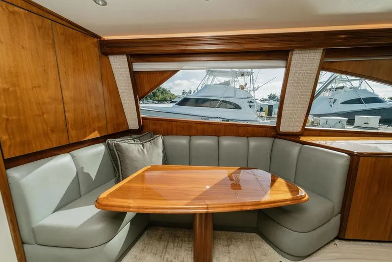 Trailer Trash Yacht Photos Pics Luxurious interior of 2021 Viking 58 Convertible yacht with elegant wood and leather seating.