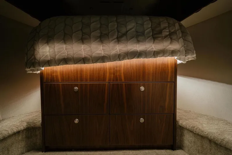 Trailer Trash Yacht Photos Pics Luxurious cabin interior of 2021 Viking 58 Convertible yacht with elegant wood cabinetry.