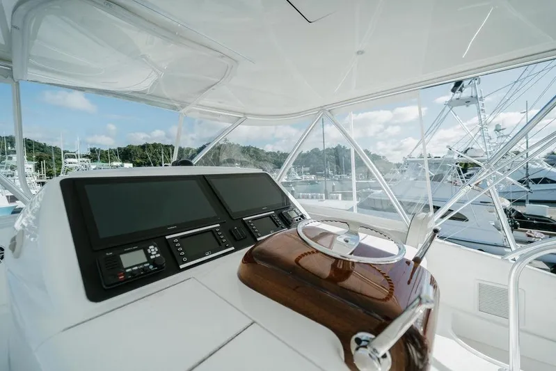 Trailer Trash Yacht Photos Pics Interior view of 2021 Viking 58 Convertible yacht helm with modern controls.