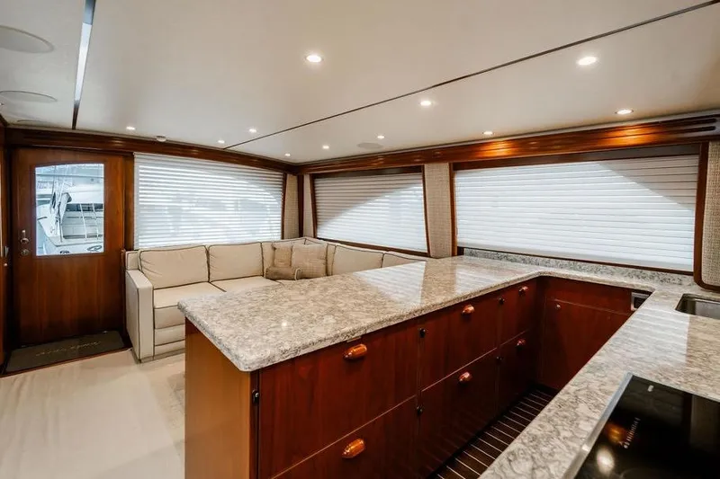 Trailer Trash Yacht Photos Pics Luxurious interior of 2021 Viking 58 Convertible yacht with elegant wood and marble finishes.