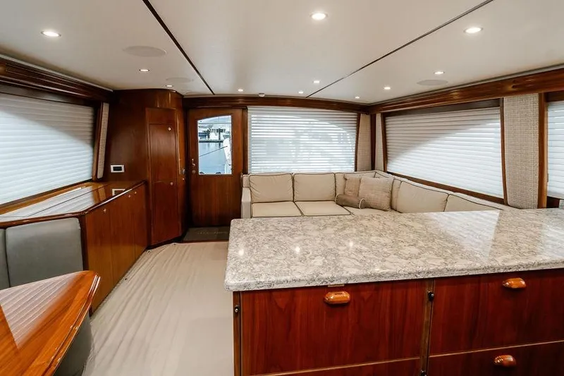 Trailer Trash Yacht Photos Pics Luxurious interior of 2021 Viking 58 Convertible yacht with elegant wood and marble finishes.